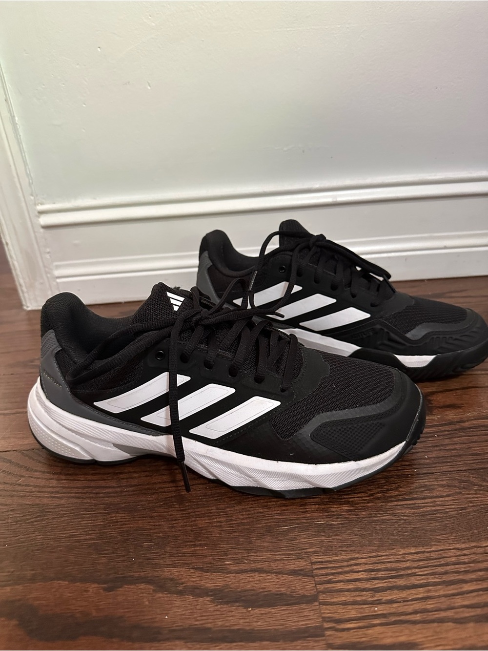 adidias Courtjam Black and White Athletic Sneakers with Stripe Detail